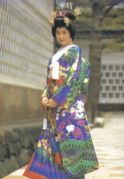 A woman wearing an elaborate Kimono.